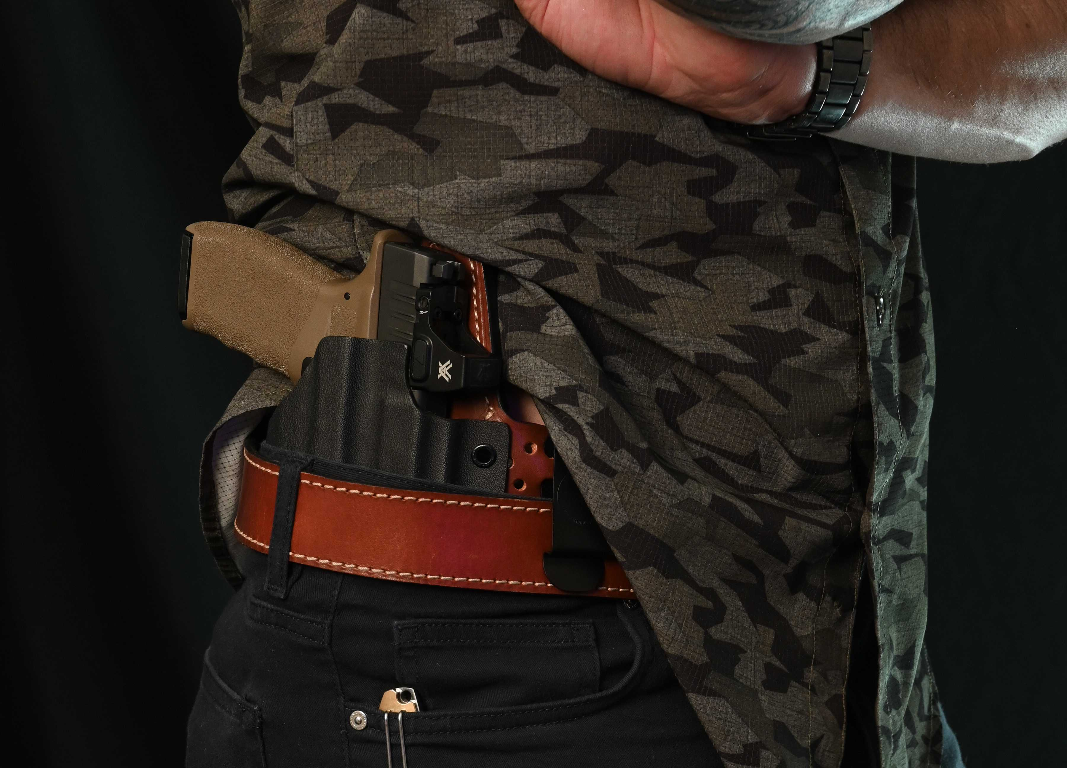 Glock 19 with a light in a straight on the hip IWB holster