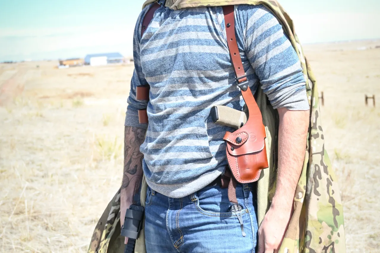 Springfield Hellcat Pro with a light in a shoulder holster Springfield Hellcat Pro with a light in a shoulder holster