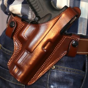 Easy on pancake style OWB leather holster with thumb break